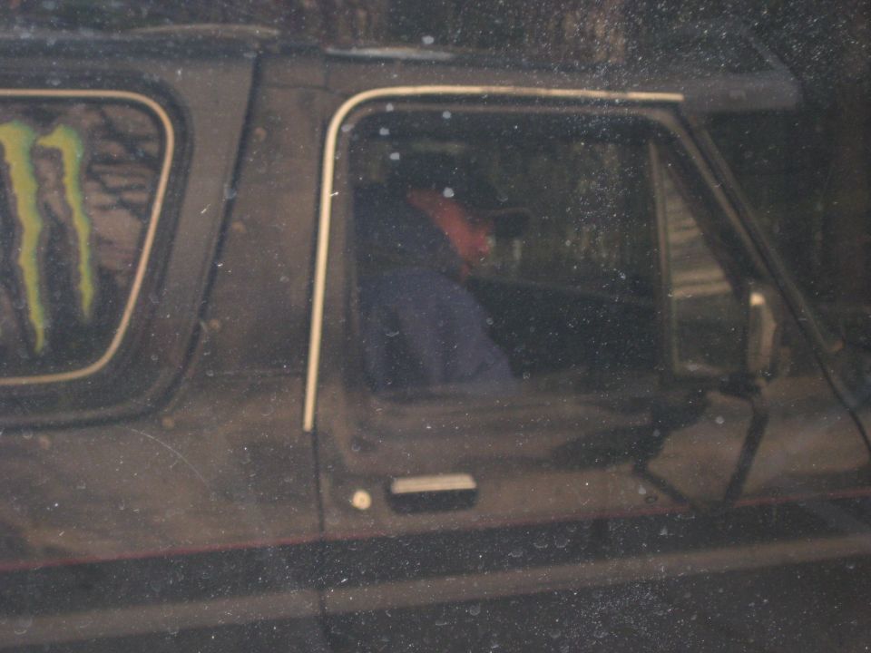 Black SUV side view with Monster Energy logo on rear window