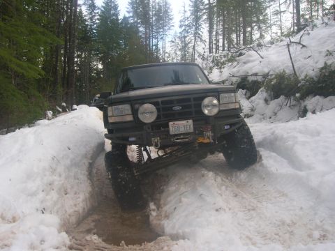 1996 Ford Bronco - This 1996 Ford Bronco navigates a snow-covered path in a wooded area.