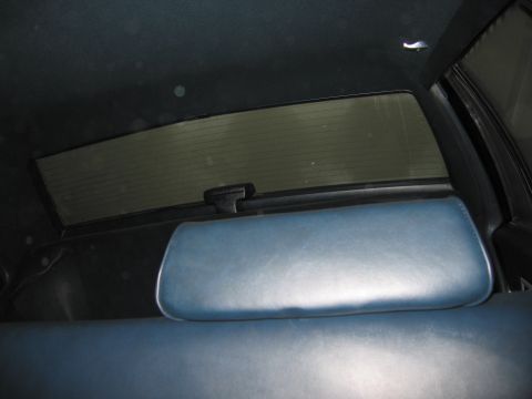 1991 Ford LTD Crown Victoria - Interior view of the rear seat and headrest in a 1991 Ford Crown Victoria LTD.