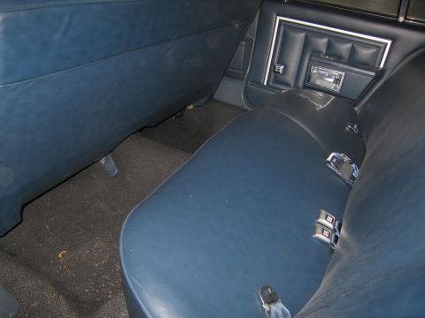 1991 Ford LTD Crown Victoria - Interior view of a car's rear seat and door panel.
