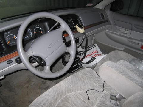 1991 Ford LTD Crown Victoria - Interior view of a 1991 Ford Crown Victoria LTD, equipped with a CB radio and aftermarket accessories.