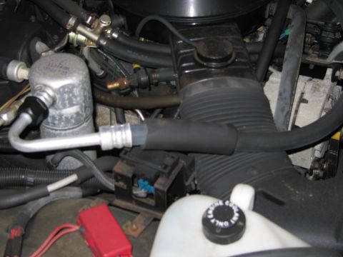 1991 Ford LTD Crown Victoria - Close-up view of an engine bay, showing various components and hoses.