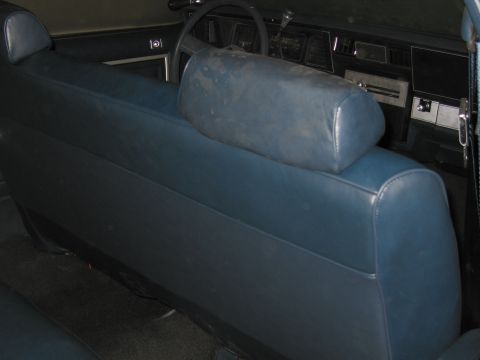 1991 Ford LTD Crown Victoria - Interior view of a car showing the front bench seat and dashboard.