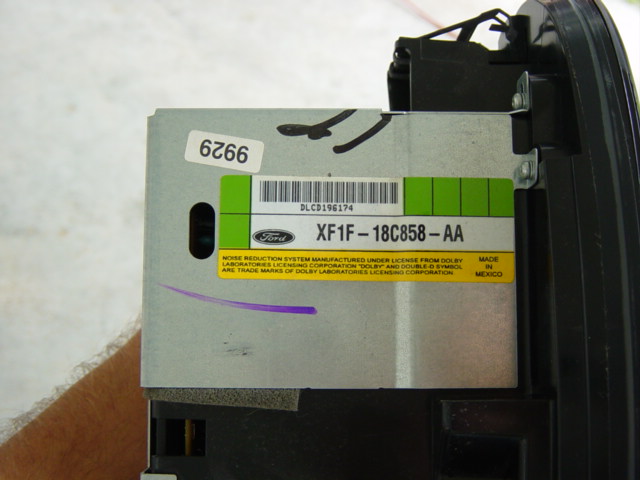 Ford radio unit label with part number XF1F-18C858-AA and barcode