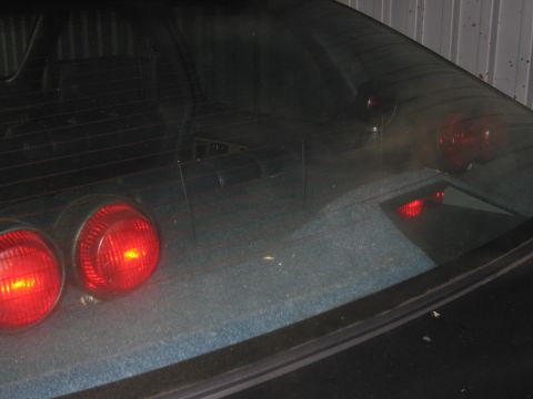 1991 Ford LTD Crown Victoria - Rear view of a 1991 Ford Crown Victoria LTD, showing the taillights and rear window.