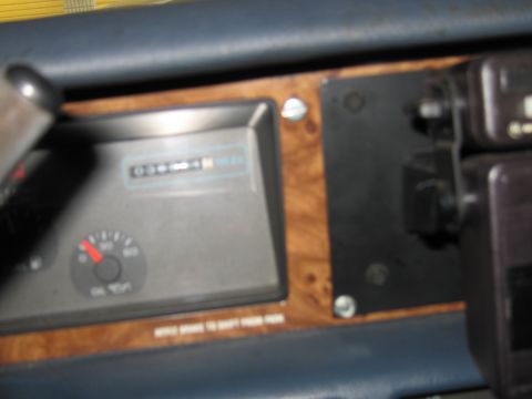 1991 Ford LTD Crown Victoria - Interior view of a dashboard an odometer and an oil pressure gauge.