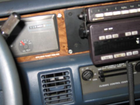 1991 Ford LTD Crown Victoria - Dashboard view of a 1991 Ford Crown Victoria LTD, showing the climate control panel and radio.