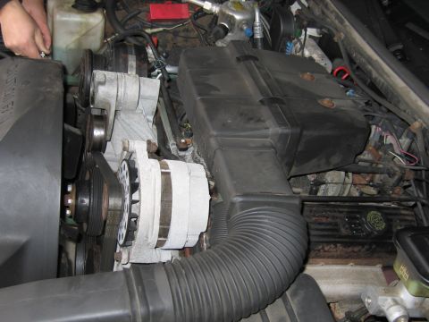 1991 Ford LTD Crown Victoria - Close-up view of a car's engine bay, showing various components and wiring.