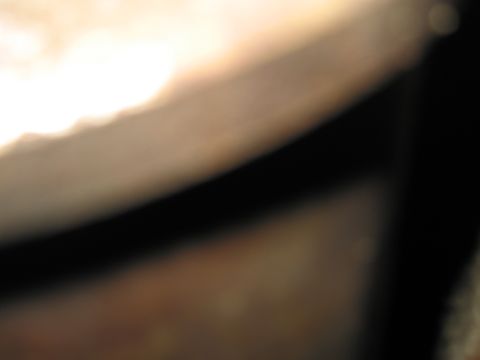 1991 Ford LTD Crown Victoria - Abstract image with blurred light and dark shapes.