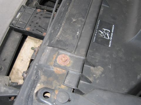 1991 Ford LTD Crown Victoria - Photograph of a vehicle's front radiator support and components with an accessory mounting sticker.