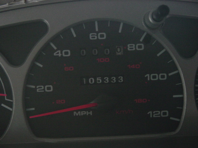 Close-up of speedometer reading 0 MPH with odometer showing 105333 miles.