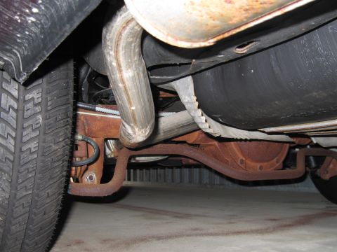 1991 Ford LTD Crown Victoria - Photograph of a vehicle undercarriage, not a technical document.