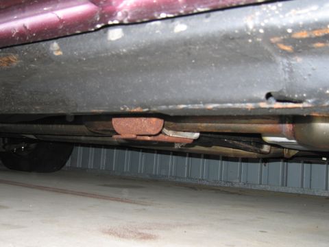 1991 Ford LTD Crown Victoria - Photograph of a vehicle undercarriage, not a technical document.