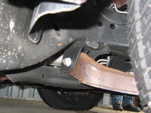 1991 Ford LTD Crown Victoria - Photograph of a vehicle undercarriage, not a technical document.