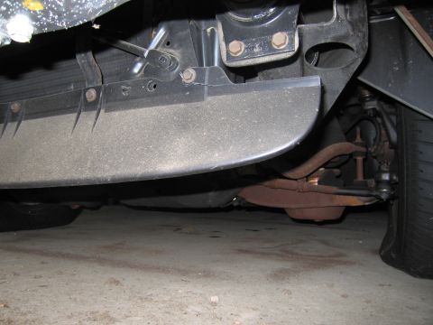 1991 Ford LTD Crown Victoria - Photograph of a vehicle undercarriage, not a technical document.