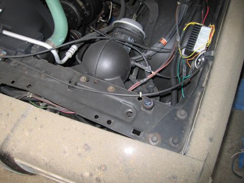 1991 Ford LTD Crown Victoria - Photograph of an engine compartment showing hoses and a relay, not a technical document.