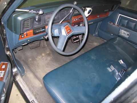 1991 Ford LTD Crown Victoria - Photograph of a car interior, dashboard and front bench seat, not a technical document.