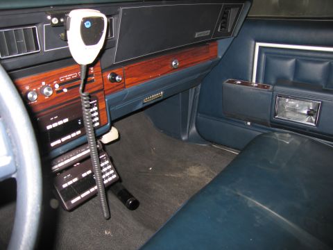 1991 Ford LTD Crown Victoria - Photograph of a vehicle interior dashboard and door panel, not a technical document.