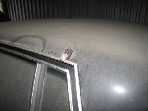 1991 Ford LTD Crown Victoria - Photograph of a vehicle roof and window molding, not a technical document.