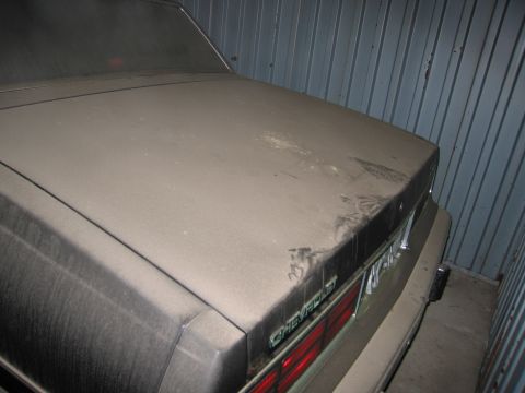 1991 Ford LTD Crown Victoria - Photograph of a vehicle trunk lid and rear end, not a technical document.