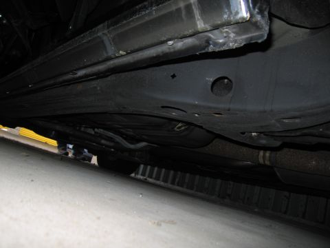 1991 Ford LTD Crown Victoria - Photograph of a vehicle undercarriage and frame, not a technical document.