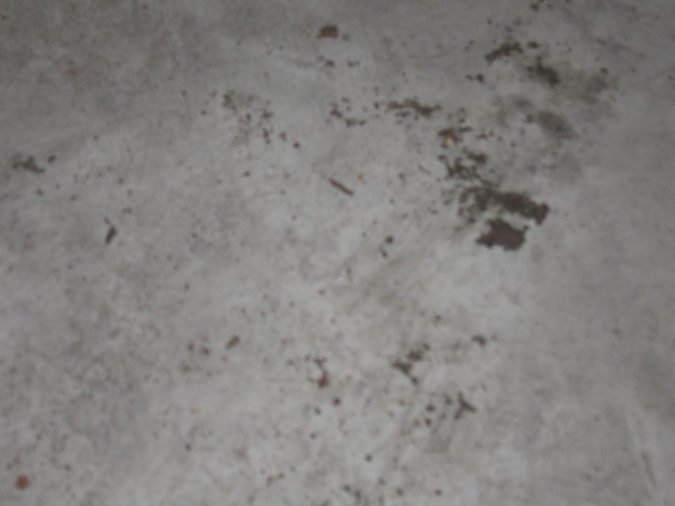 Photo of a dirty concrete floor surface