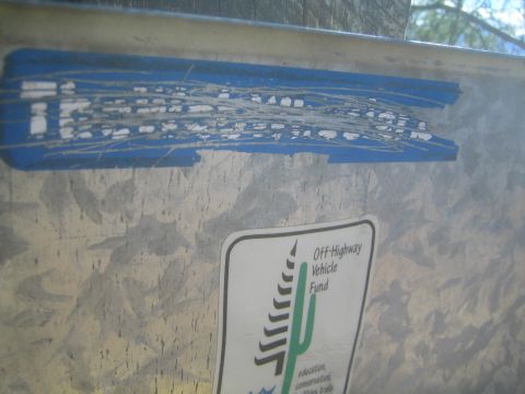 1968 Ford Mustang - A metal surface is adorned with two stickers, one blue and one with a cactus graphic.