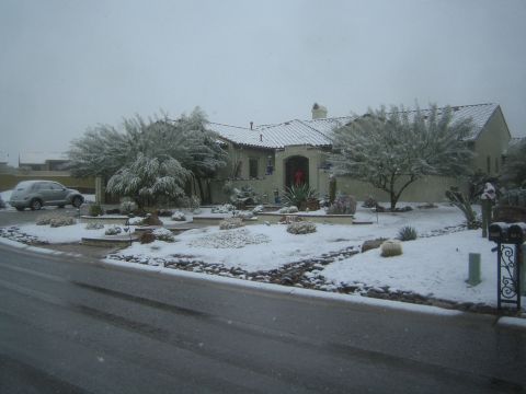 1968 Ford Mustang - A rare snow event blankets a desert home and its surroundings, with a car visible in the driveway.