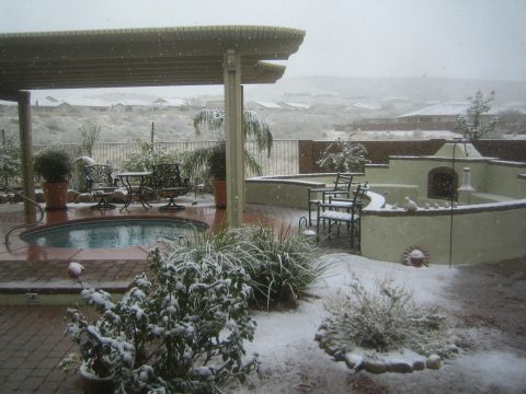 1968 Ford Mustang - A backyard scene shows patio furniture and a hot tub covered in snow.