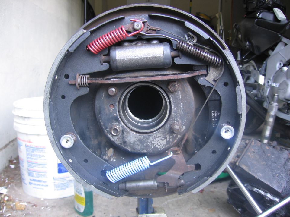 Brake drum assembly with new springs and brake shoes