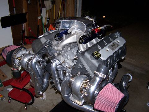 2007 Ford Mustang - A V8 engine with twin turbochargers and custom intake manifold is displayed.