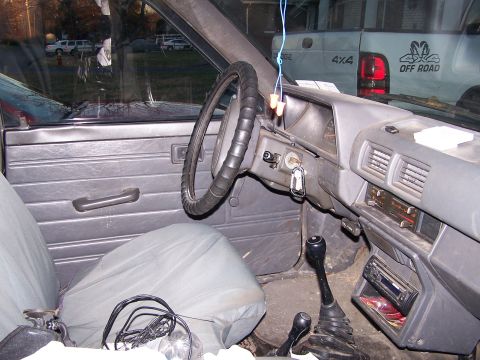 1988 Toyota Pickup/SR5 - Interior view of a 1988 Toyota Pickup/SR5, with another vehicle seen through the windshield.