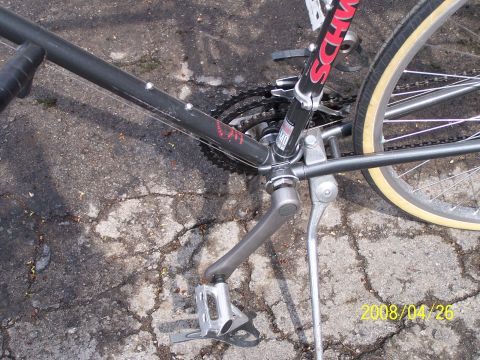 1988 Toyota Pickup/SR5 - Close-up view of a black bicycle's frame, drivetrain, and rear wheel, showing the Schwinn branding.