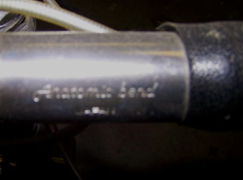 1988 Toyota Pickup/SR5 - A close-up view of a metal pipe with text stamped into its surface.