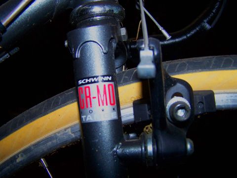 1988 Toyota Pickup/SR5 - Close-up view of a bicycle fork with Schwinn branding and a yellow tire visible.