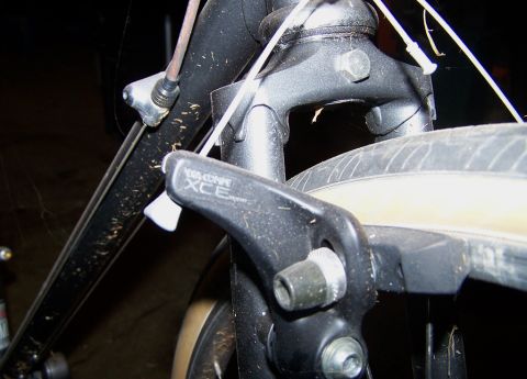 1988 Toyota Pickup/SR5 - Front brake caliper on a bicycle, showing the 'DIA-COMPE XCE' label.