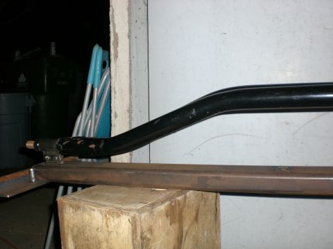 1990 Ford Bronco - A black metal bar and frame are shown, possibly part of a vehicle modification or build.