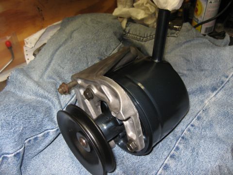 1968 Shelby GT500 - A power steering pump assembly is shown, detached from a vehicle.