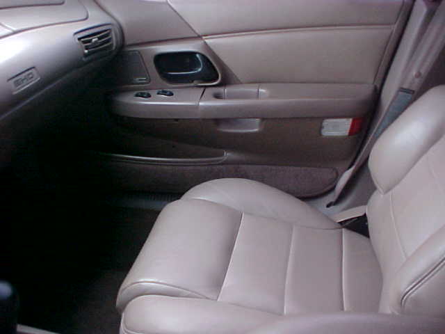 Tan leather front passenger seat and door panel vehicle interior