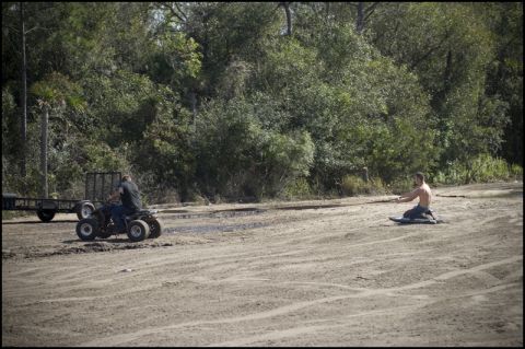 1996 Ford F-150 - Two men are in a dirt area with an ATV and a trailer, surrounded by trees.