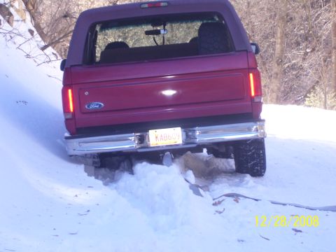 1993 Ford Bronco - A red 1993 Ford Bronco navigates a snowy trail on December 28, 2008.