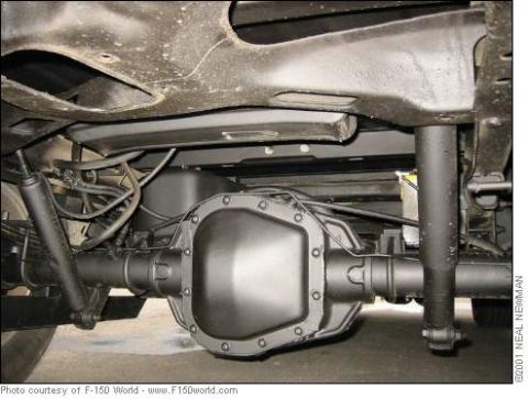 2007 Ford Mustang - The rear axle assembly and suspension components of a truck are visible from underneath.