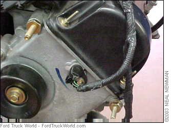 2007 Ford Mustang - Detail of a Ford engine part, likely from a truck, with visible wiring.