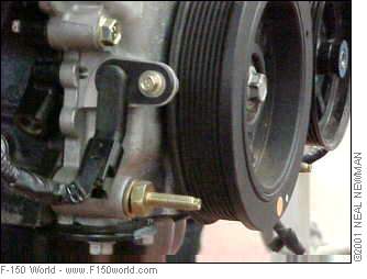 2007 Ford Mustang - Detail of an engine component, possibly a sensor attached to a pulley system.