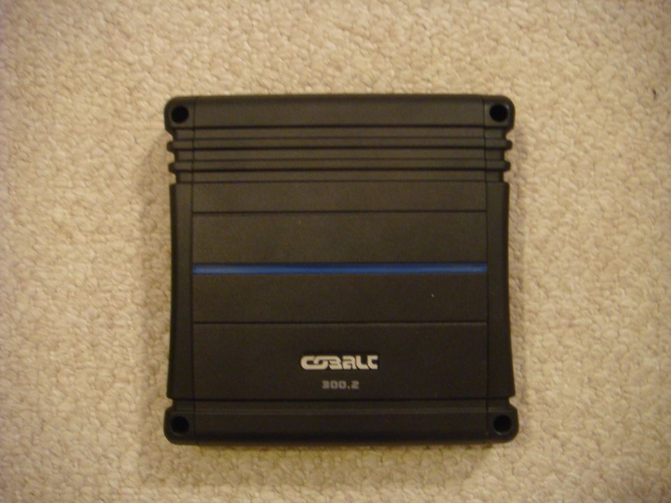 Black Cobalt 300.2 two-channel car amplifier on carpet
