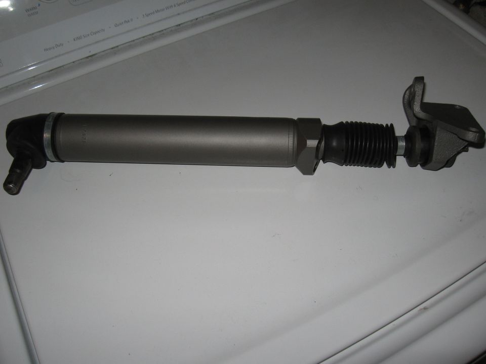 Automotive tie rod end assembly, gray metal with black rubber boot.