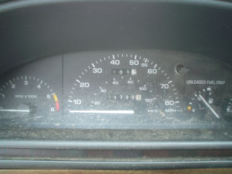 1989 Mercury Topaz - The dashboard gauges of a 1989 Mercury Topaz show 001 miles and "UNLEADED FUEL ONLY" text.