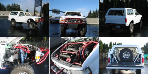 1991 Ford Bronco - A white 1991 Ford Bronco is shown with extensive off-road modifications, including a custom front bumper, roll cage, and lifted suspension.…