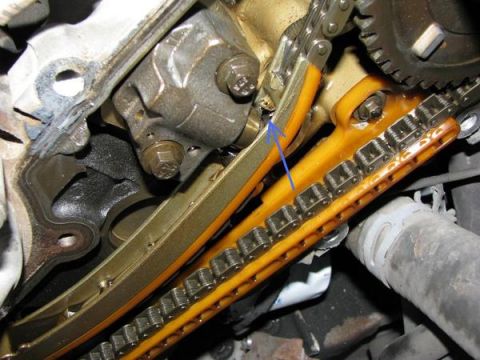 2007 Ford Mustang - Photograph of an engine timing chain, guide, and tensioner, not a technical document.