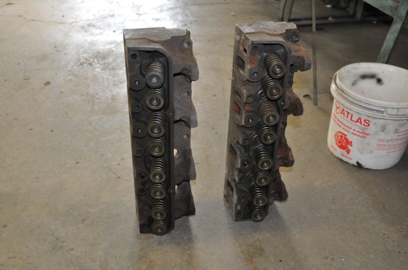 Two engine cylinder heads with visible valve springs